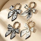 CouldNook Silver Link Scarf Phone Wrist Strap - Monochrome Bow