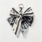 CouldNook 5.51''  Black Series Pattern Bow Bag Charm - Handle Accent