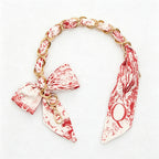 CouldNook 16.54’’ Printed Bow Chain Bag Strap - Soft Accent