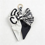 CouldNook 5.51''  Black Series Pattern Bow Bag Charm - Handle Accent