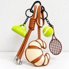 CouldNook Tennis Bag Charm - Croissant Detail and Knotted Hanging Strands