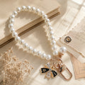 CouldNook Bow and Flower Phone Tab Charm - Pictured motif detailing