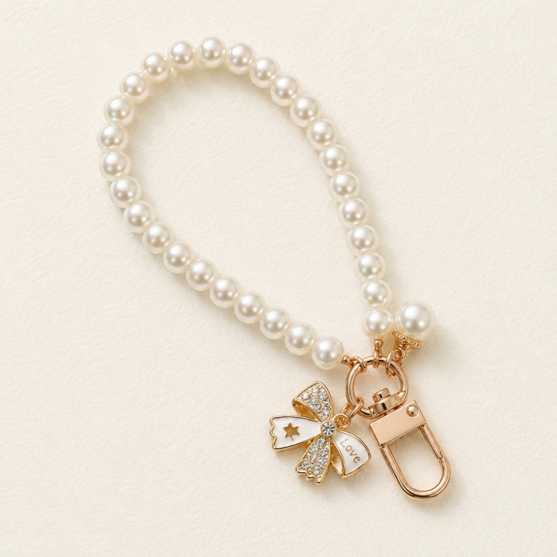 CouldNook Bow and Flower Phone Tab Charm - Pictured motif detailing