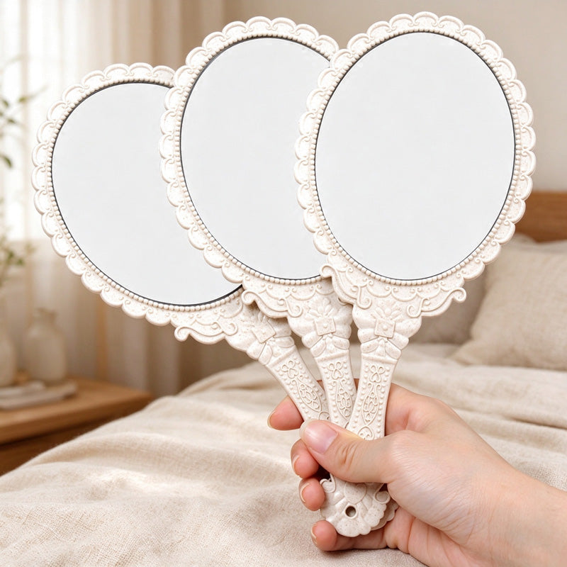 Scalloped Oval Hand Mirror with Ornamental Floral Handle