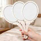 Scalloped Oval Hand Mirror with Ornamental Floral Handle