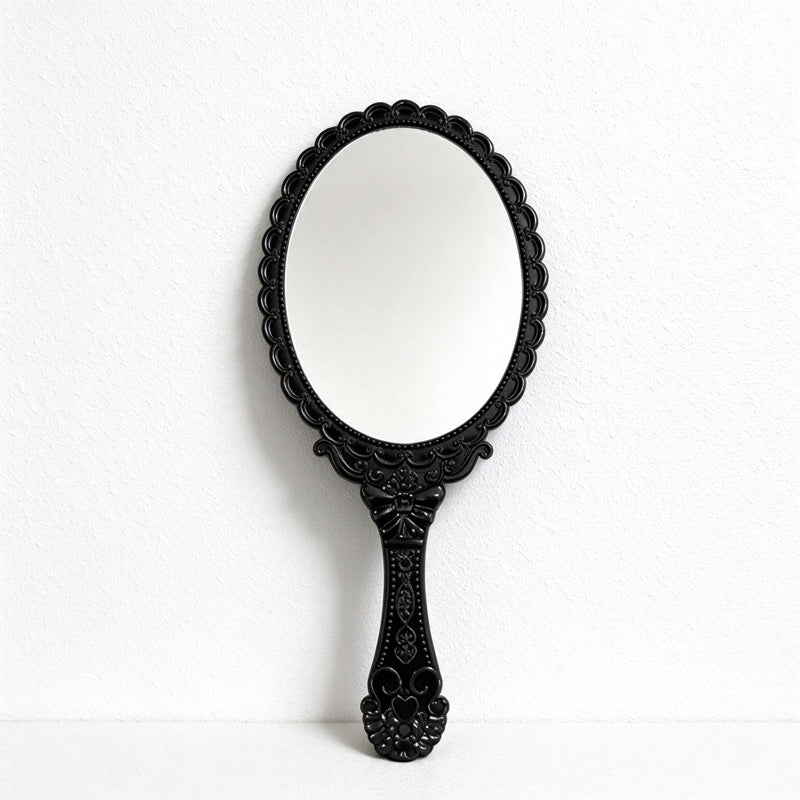 Scalloped Oval Hand Mirror with Ornamental Floral Handle
