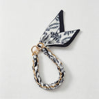 CouldNook Monochrome Scarf Phone Wrist Strap - Neutral Bow Loop