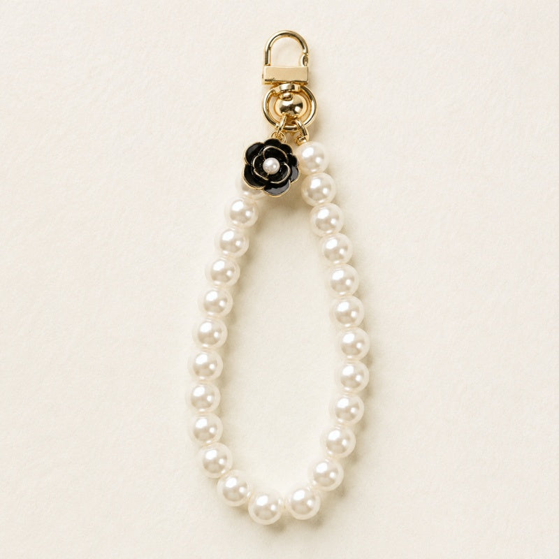 CouldNook Bow and Flower Phone Tab Charm - Pictured motif detailing