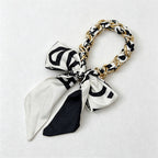 CouldNook Silver Link Scarf Phone Wrist Strap - Monochrome Bow