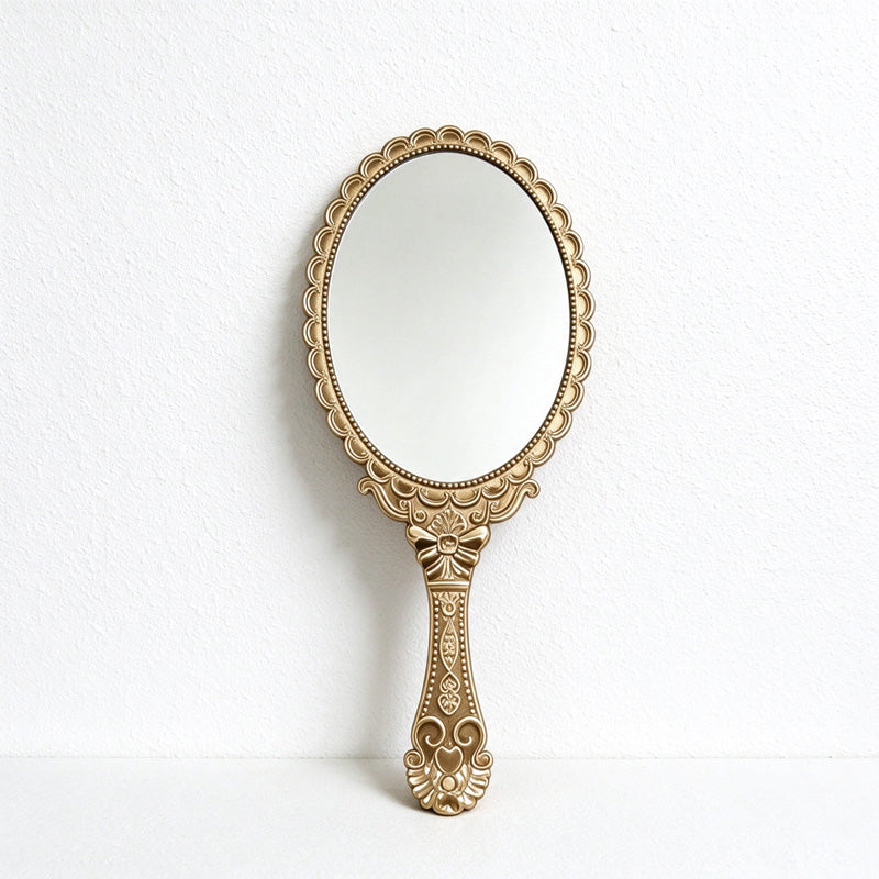 Scalloped Oval Hand Mirror with Ornamental Floral Handle