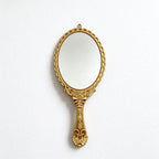 Scalloped Oval Hand Mirror with Ornamental Floral Handle