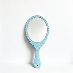 Scalloped Oval Hand Mirror with Ornamental Floral Handle